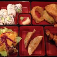 California Roll Bento Box · Includes six pieces California roll, mix tempura, gyoza, and chicken yakitori. Includes salad.