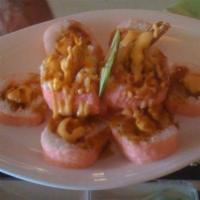 Pink Panther Roll · Shrimp tempura, krab salad, cream cheese wrapped in soy paper; spicy mayo, eel sauce on top.