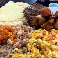 Calentado La Negra · Breakfast with rice, beans, pork rinds, corn cake, grilled steak and eggs.