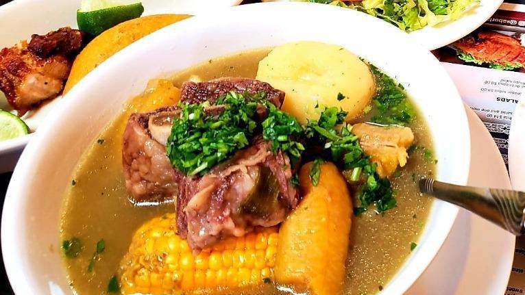 Sancocho De Costilla · Beef rib soup comes with rice, ensalada and a small corn cake (arepita).