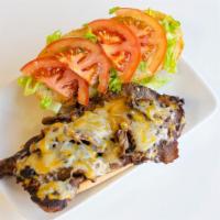 Baltimore Style Cheesesteak · Baltimore style cheesesteak with lettuce, tomatoes, mayo, and cheddar cheese.