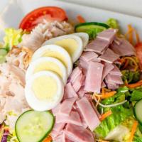 Chef Salad · With ham, turkey, boiled egg, over a house salad and choice of dressing.