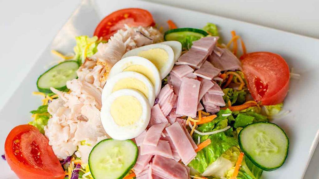 Chef Salad · With ham, turkey, boiled egg, over a house salad and choice of dressing.