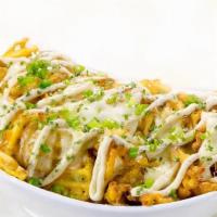 Truffle Fries · Elevate your meal with your hand-cut, crispy waffle fries bathed in authentic melted cheese ...