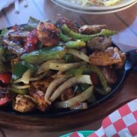 Tin Roof Fajitas · A delicious mix of your choice of protein sauteed with onions and red and green bell peppers...