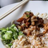 Pork Chasyu Bowl · Rice, pork belly, white sauce, sweet soy reduction, scallion, fried French onion, sesame seed.