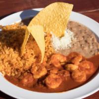 Camarones A La Diabla · Cooked shrimp covered in a red chili pepper sauce, Served with rice and beans.