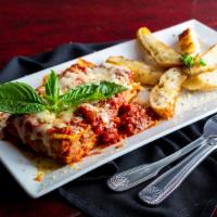Meat Lasagna · Homemade with meat sauce, ricotta cream, five cheeses and marinara.
