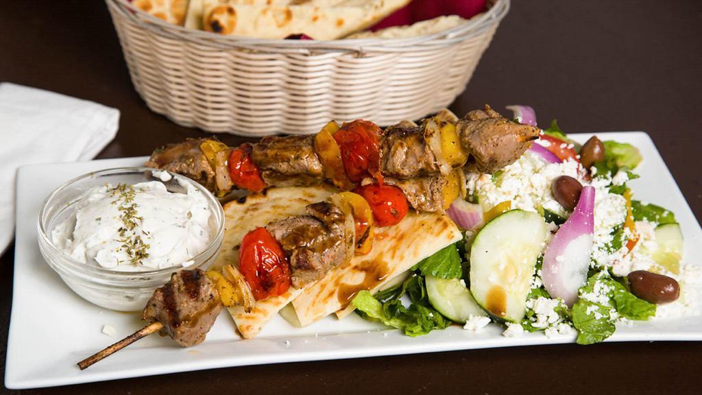 Plaka Souvlaki Platters · Kabob plate served with pita, tzatziki and small Greek salad.