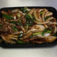 Mongolian Beef · Sliced beef with green onions and bell peppers stir-fried with satay spicy sauce. Spicy.