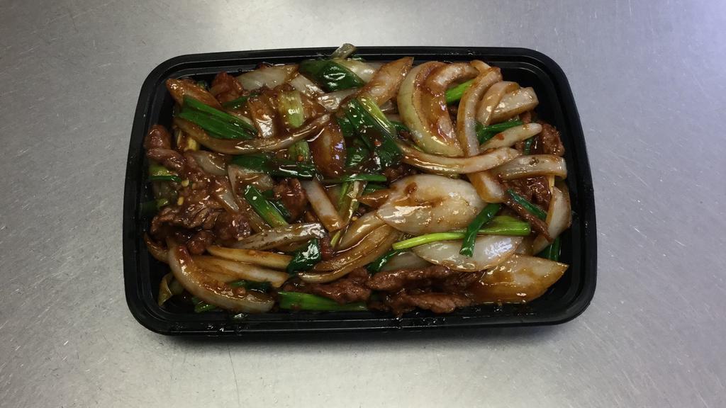 Mongolian Beef · Sliced beef with green onions and bell peppers stir-fried with satay spicy sauce. Spicy.