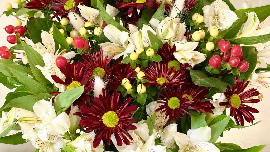 Love In The Air · Gorgeous Red Flowers with a Pinch of White in a glass vase. Because we love to spread love!

While we always try to follow the color palette, we may replace stems to deliver the freshest flowers.