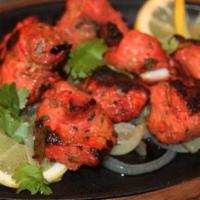 Grilled Tikka Appetizer · Tender 4 pcs boneless Chicken/Lamb, marinated in yogurt, mild spices, and herbs roasted in t...