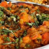 Aloo Motor Gobi · (Vegan). Potatoes, green peas and cauliflower cooked in a curry sauce.