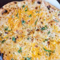 Garlic Cheese Naan · White flour bread stuffed with cheese and topped with garlic and cilantro