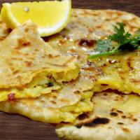 Aloo Paratha · Whole flour bread stuffed with potato and baked in a clay oven