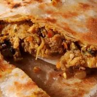Keema Naan · White flour bread stuffed with minced chicken baked in a clay oven