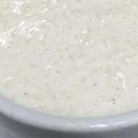 Rice Pudding · Creamy basmati rice pudding flavored with raisin and cardamom