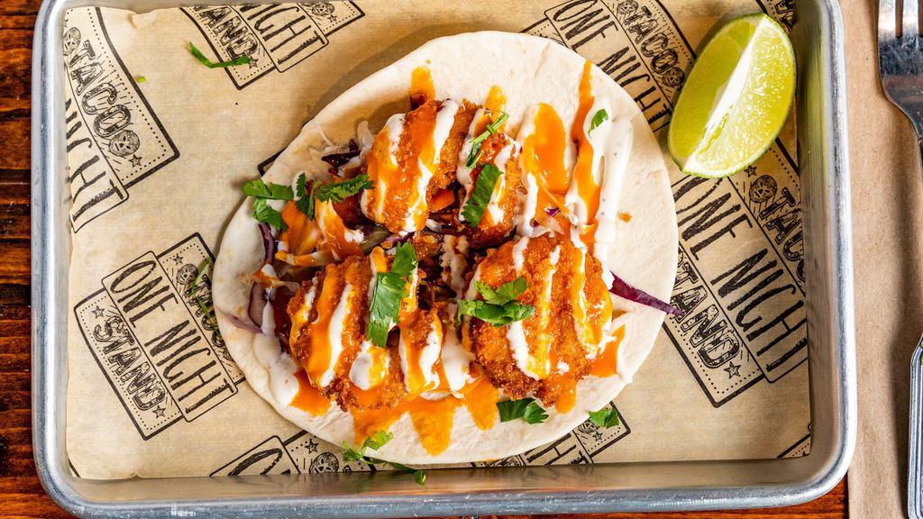 Sriracha Shrimp Taco · Deep fried southern jumbo shrimp, tossed in our sriracha buffalo sauce and topped with cabbage and ranch.