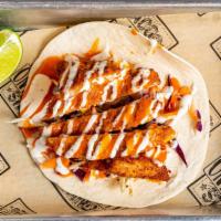 Buffalo Chicken Taco · Deep fried chicken, tossed in our buffalo ranch sauce and topped with cabbage.