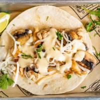The Shroom · Grilled chicken topped with mushrooms, shredded cheese and queso dip.