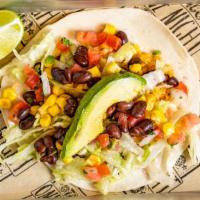 Veggie Taco · Lettuce, black beans, corn, fresh lime pico de gallo, rice and topped with avocado slices. S...