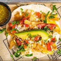 Breakfast Taco · Scrambled eggs, corn tortilla strips, tomatillo sauce, avocado, fresh lime pico de gallo and...