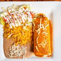Burrito Supreme · A flour tortilla rolled and stuffed with ground beef or shredded chicken, topped with red sa...