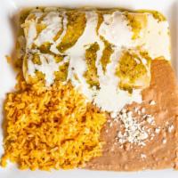 Enchiladas Suizas · 2 soft corn tortillas rolled and stuffed with chicken and topped with green tomatillo sauce ...