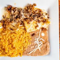 Chori Chicken · Grilled chicken topped with chorizo and queso dip. Served with a side of rice, refried beans...