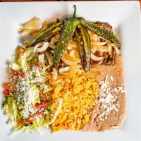 Carne Asada · Carne asada grilled steak sliced thin with rice, refried beans, queso fresco, lettuce, tomat...