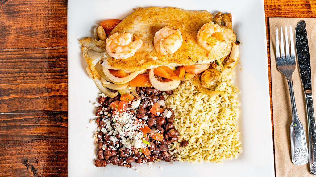 One Night Fish Platter · Grilled fish and shrimp made with grilled vegetables (onions, zucchini, mushroom and tomatoes), served with cilantro rice and black beans.