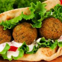 Falafel · Delicious four patties of ground cooked garbanzo beans mixed with a special blend of spices,...