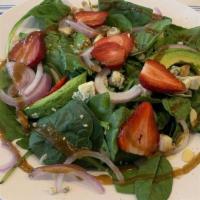 Spinach Salad · Baby spinach, crumbled blue cheese, strawberries, avocado, onions, almonds, and balsamic vin...