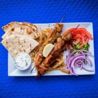 Chicken Souvlaki Platter · 2 chicken skewers with pita bread, Greek fries, Meraki Sauce, Sliced Tomatoes & Romaine Lett...