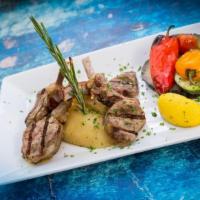 Lamb Chops · Char-grilled lamb chops served with oven roasted lemon potatoes and grilled veggies