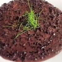 Truffle Risotto · Organic black “Venere” rice, truffle oil, and parmigiano reggiano.