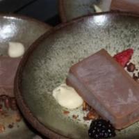 Chocolate · Chocolate fudge, white chocolate, nuts crumbles, and subzero raspberry.