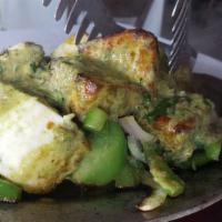 Mater Paneer · House made cheese curds stewed with green peas and mild spices and served in a rich sauce.