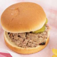Pulled Pork Sandwich · 1/4 lb of smoked pulled pork topped with dill pickles and BBQ sauce on the side.