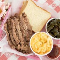Brisket Plate · 1/2 lb sliced brisket served with your choice of two sides, sliced bread, and BBQ sauce on t...