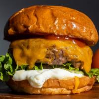 Beggars Can'T Be Cheesers · American beef patty topped with melted cheese and cooked medium served on a griddle brioche ...