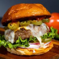 Glory Glory Jalapeño · American beef patty cooked medium topped with melted pepper jack cheese and spicy jalapeños....