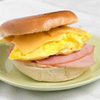 Bagel With American Cheese, Eggs, Ham Or Turkey. · 