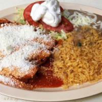  Enchiladas De Pollo · Three authentic chicken enchiladas wrapped in corn tortillas filled with shredded chicken in...