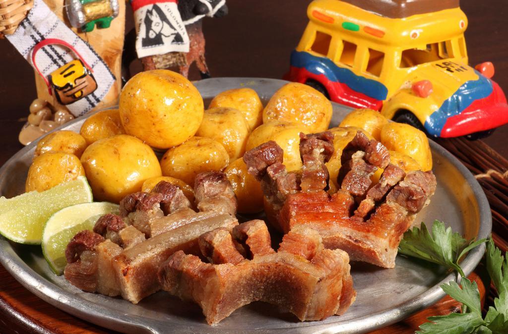 Chicharrón / Pork Belly · Chicharrón acompañado de papita criolla /Fried pork belly  with creole potatoes