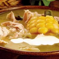 Ajiaco Del Tío Joaco / Ajiaco · Ajiaco con pollo desmenuzado acompañado de arroz, aguacate/Potato based soup with corn and s...