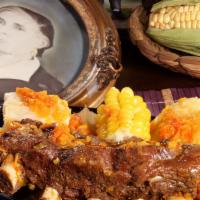 Guiso De Costilla De Res / Beef Rib Stew · Guiso de costilla con papa, yuca, plátano, mazorca y salsa criolla/
Rib stew served with pla...