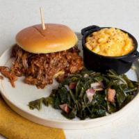 Bbq Pulled Pork · Juicy pulled pork with house BBQ sauce with your choice of two sides.