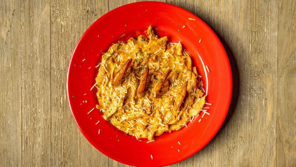Chicken Pasta Cajun Alfredo · Fettuccine pasta and tender chicken tossed in a house-made spicy alfredo. Add broccoli, shrimp, or salmon for an additional charge each.